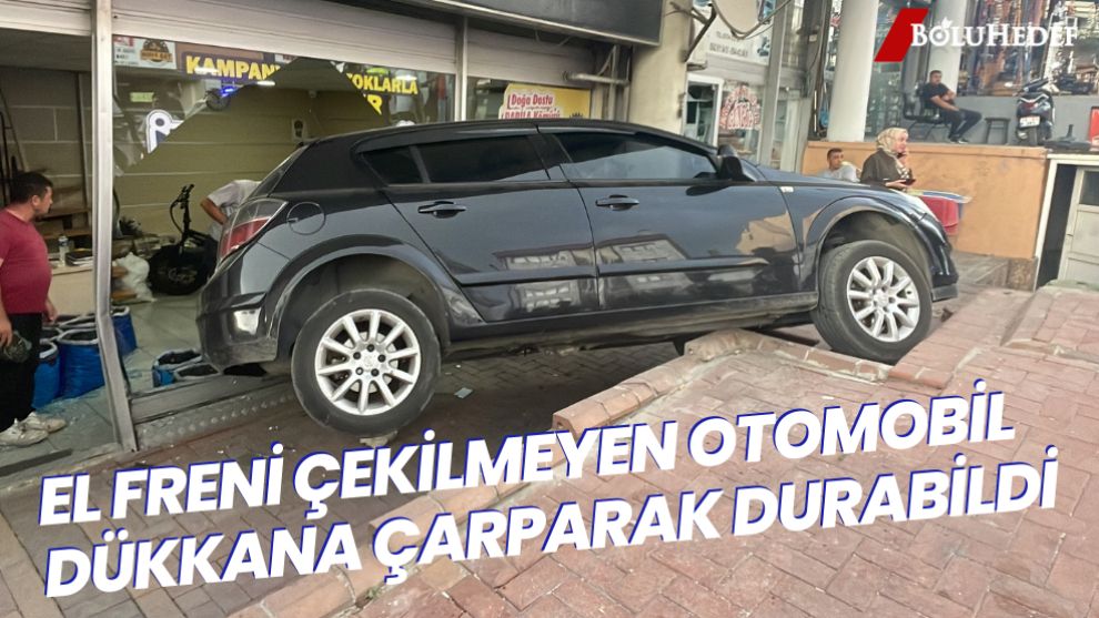 EL FRENİ ÇEKİLMEYEN OTOMOBİL DÜKKANA ÇARPTI