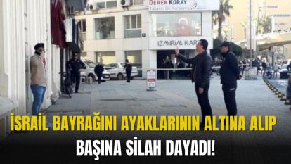 İSRAİL BAYRAĞINI AYAKLARININ ALTINA ALIP BAŞINA SİLAH DAYADI!